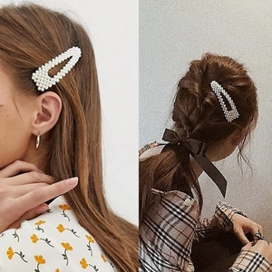 Women's woven fishline triangle pearl hair clip set showing side and back view