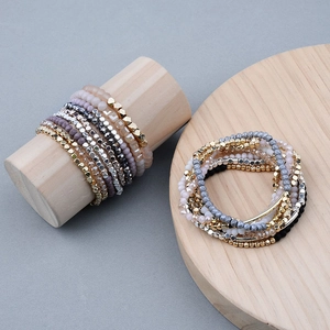 Colorful Miyuki crystal beaded bracelets with gold-tone curved tubes and elastic band
