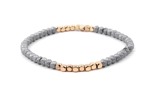 Detailed macro view of Miyuki stretch bracelet with grey faceted beads and rose gold accents