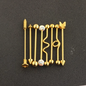 Detailed macro view of 8 different rose gold industrial barbell designs for ear piercing