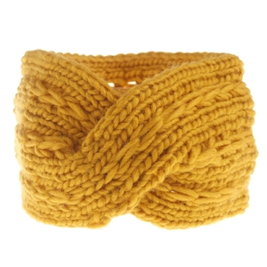 Close-up of mustard yellow chunky knit headband showing textured cross knot design
