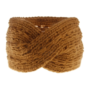 Detailed knit texture of ginger yellow winter headband with a stylish twist knot