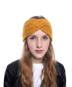 Detailed knit texture of mustard yellow twisted winter headband for women