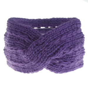 Detailed close-up of dark purple knit headband showing thick cross twist yarn texture