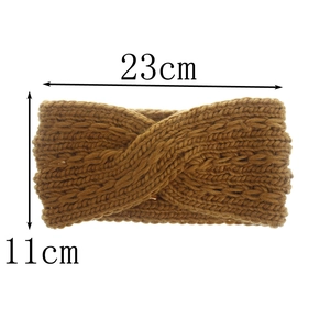 Brown knitted twisted headband showing dimensions of 23cm by 11cm on white background
