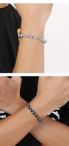 Detail of masculine titanium steel box chain bracelets in silver and vintage black finish
