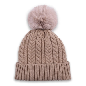 Detail of cable knit beanie in camel with fluffy faux fur pom-pom and ribbed cuff