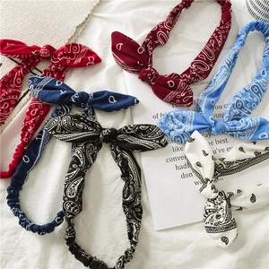 Flat lay detail of paisley cotton headbands in five colors with bow knot wire detail