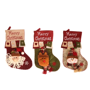 Three-piece set of premium Christmas stockings with 3D Santa, reindeer, and snowman designs