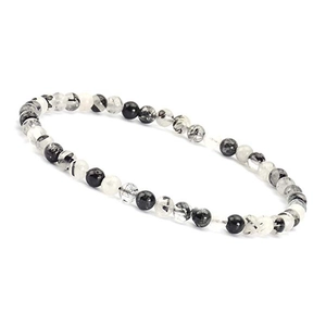 Macro shot of natural black rutilated quartz beaded bracelet on a white background