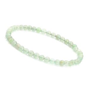 Detail of 4mm light green natural stone beads on a minimalist round beaded bracelet