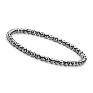 Macro detail of 4mm dark grey metallic natural stone beaded bracelet on white background