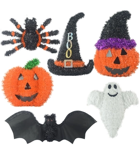 Detail view of Halloween decor set including pumpkin, ghost, bat, and witch hats on white