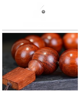 Macro shot of rosewood prayer beads showing natural wood grain and texture