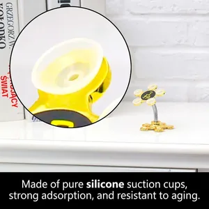 Creative gold flower suction cup car phone holder with flexible spring on a desk