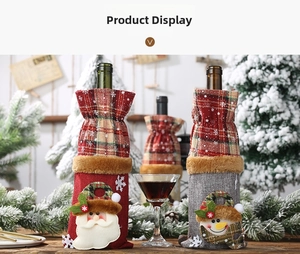 Detail of Christmas wine bottle covers featuring plaid linen and festive embroidery