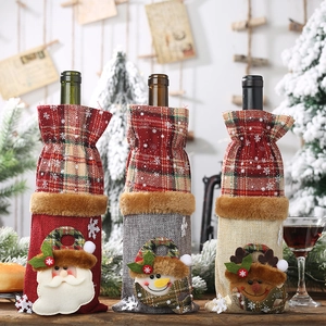 Three festive Christmas wine bottle covers featuring Santa, Snowman, and Reindeer motifs