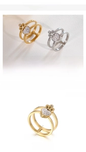 Detail view of double-layer hollow heart ring in stainless steel with pavé settings