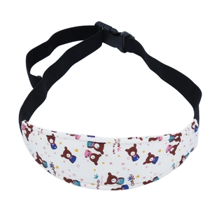 Detail showing cartoon bear print on baby car seat head support belt with adjustable buckle