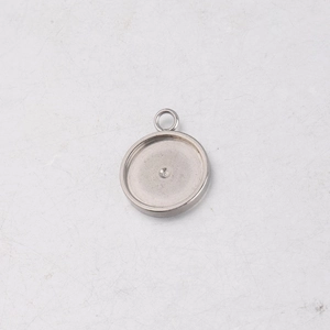 Detailed view of a silver stainless steel pendant tray for DIY jewelry making