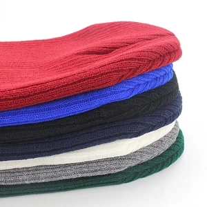 Unisex ribbed knit beanies in multiple colors including navy, red, and emerald green