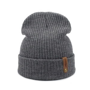 Deep grey ribbed knit beanie for adults with a stylish brown leather logo patch