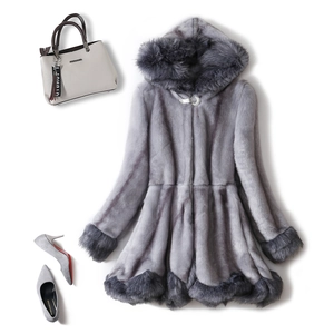 Detail of grey faux fur coat featuring plush trim, crystal buckle and elegant hood
