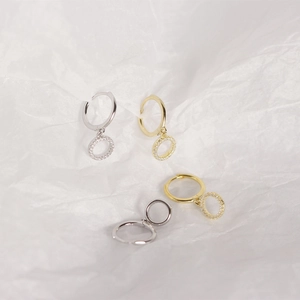 Detailed view of silver and gold plated s925 sterling silver hoop earrings with clear crystals