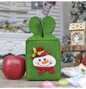 Detail of green felt Christmas gift bag with a 3D snowman and heart-shaped handle