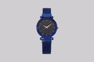 Detail of starry blue dial watch with crystal markers and mesh magnetic strap