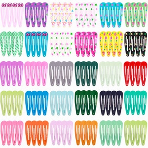 Detailed grid showing colorful metal snap hair clips with star and polka dot patterns