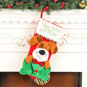 Large Christmas stocking with cartoon dog pattern hanging on a festive decorated fireplace