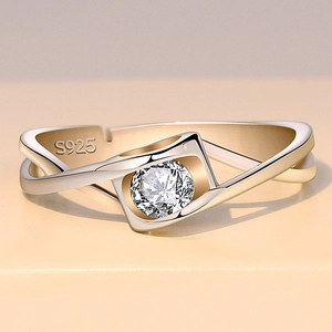 Macro detail of S925 sterling silver stamp and sparkling round cubic zirconia on the ring