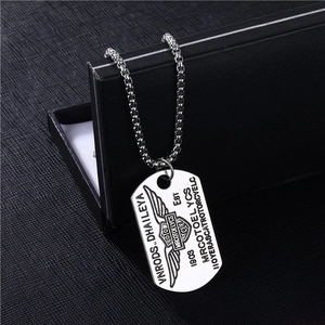 Detail of silver stainless steel military dog tag necklace with engraved hip hop design