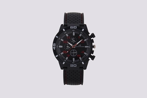 Detail shot of GT Grand Touring sports watch dial with red stitching on black silicone strap