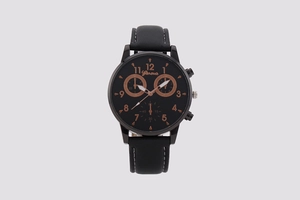 Detailed view of black quartz watch with three sub-dials and copper numbers