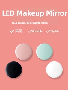 Foldable LED makeup mirror in pink, mint, black and white showing 10X magnification