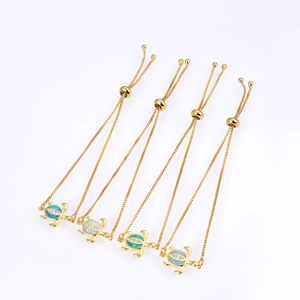 Adjustable gold turtle bracelets with colorful opal inlay and sparkling zircons