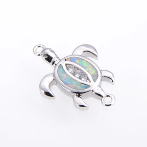 Detailed silver turtle connector with white opal and clear cubic zirconia stones