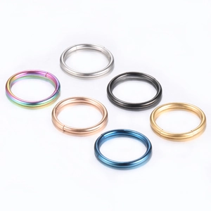 Set of stainless steel open nose rings in silver, gold, rose gold, black, blue, and rainbow
