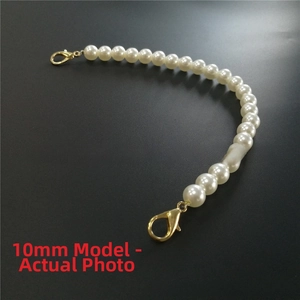 Detail of 10mm white faux pearl chain featuring dual golden lobster clasps for bags
