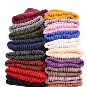 Unisex ribbed knit wool beanie in various colors stack for warm autumn winter comfort