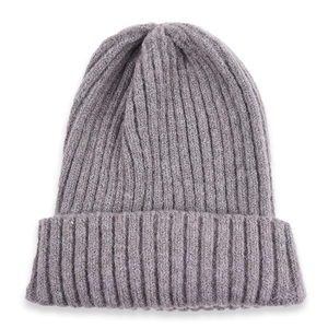 Detail view of the gray ribbed knit beanie showing thick texture and folded cuff style