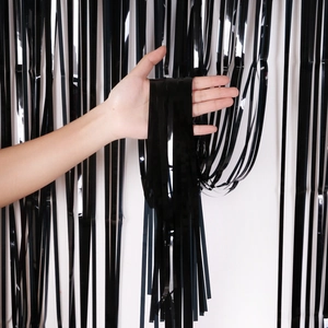 Metallic black fringe curtain for Halloween party decor shown with high-quality texture
