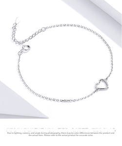 Detail of S925 sterling silver chain with hollow heart charm and adjustable lobster clasp