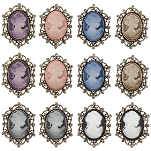 Vintage cameo brooches set with rhinestone metal frames in various elegant colors