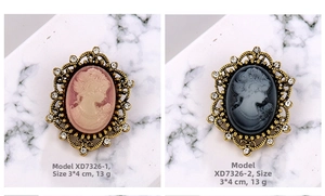 Detail of vintage cameo brooches with rhinestones, size 3x4cm and weighing 13g each