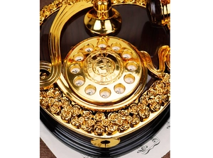Close-up of vintage music box dial with Have a Nice Day engraving and golden roses
