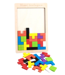 Detailed view of colorful wooden tetris puzzle blocks scattered on a white background