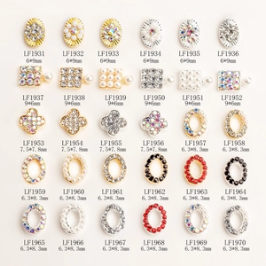 Macro display of alloy nail charms with sunflowers and tortoises in 5x6 grid layout